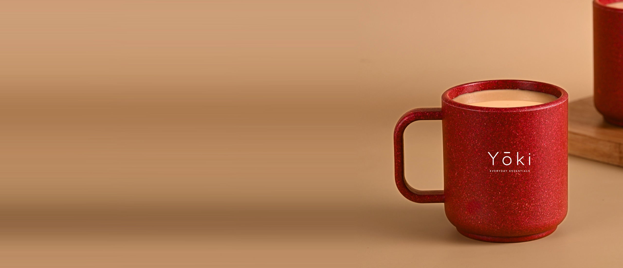 Yōki coral mug on a warm table